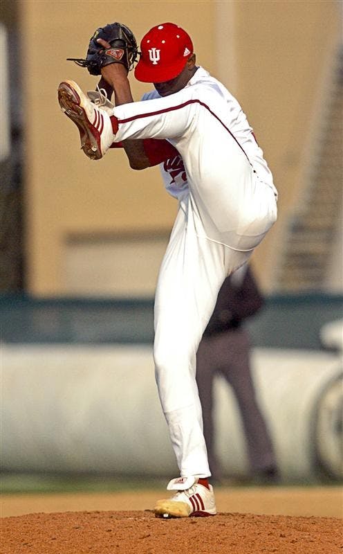 IU pitcher Chris Squires starts his wind up April 8 at Sembower Field. Squires pitched 2 2/3 innings, giving up just one hit and two walks to earn his first save of the season.