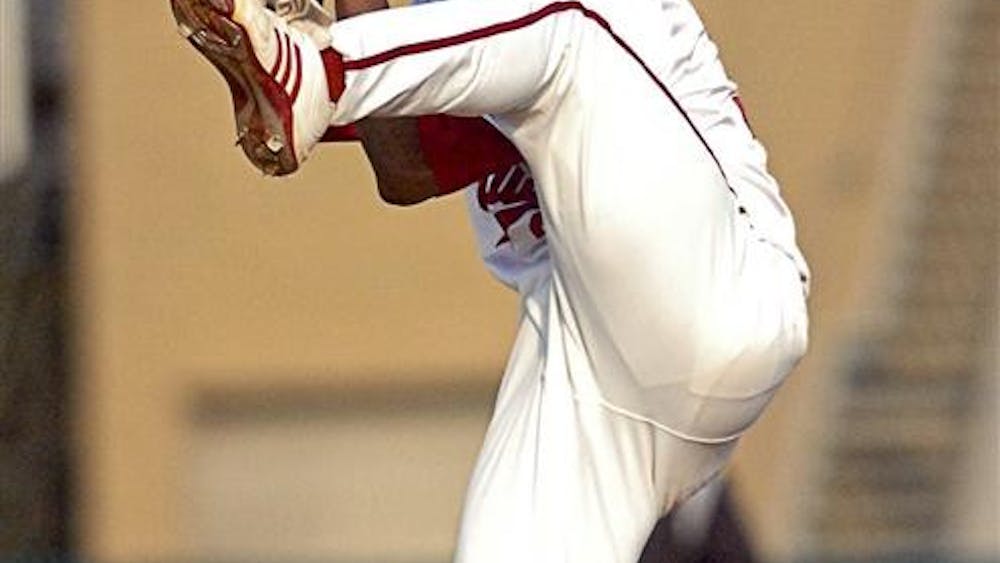 IU pitcher Chris Squires starts his wind up April 8 at Sembower Field. Squires pitched 2 2/3 innings, giving up just one hit and two walks to earn his first save of the season.