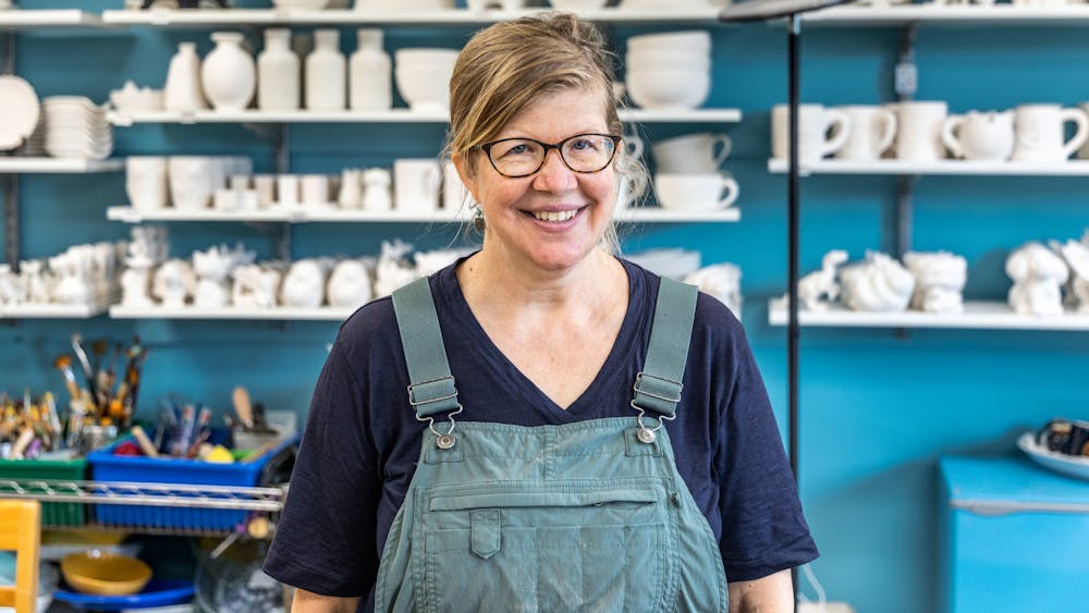 Susan Snyder, the Pottery House Studio owner, poses for a picture inside her business Sept. 4, 2021. Snyder opened the studio in Bloomington after studying pottery in Italy.
