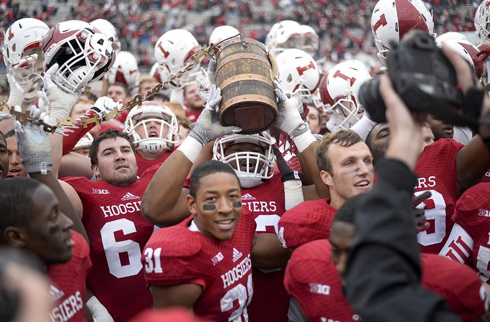 The Hoosiers sing the Indiana fight song after defeating Purdue 23-16 on Saturday at Memorial Stadium, keeping the Old Oaken Bucket in Bloomington for another year.