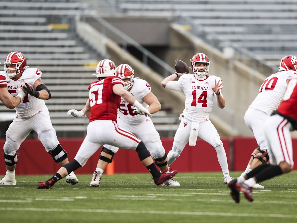 IU quarterback Jack Tuttle tosses the ball during the game Dec. 5 against the Wisconsin Badgers at Camp Randall Stadium in Madison, Wisconsin. IU won 14-6.
