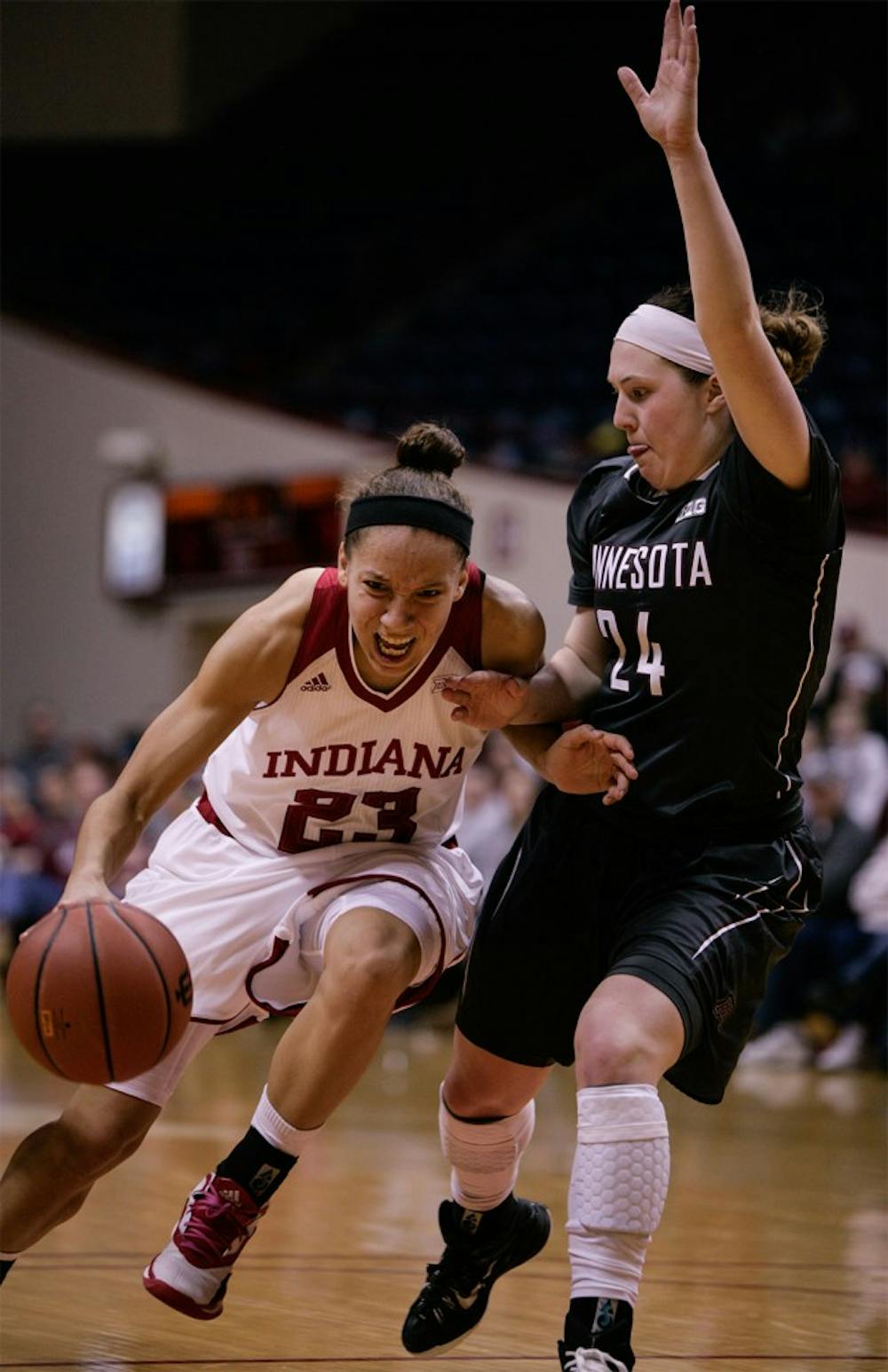 Junior guard Alexis Gassion dribbles the ball up the court against a Minnesota defender Feb. 18 at Assembly Hall.