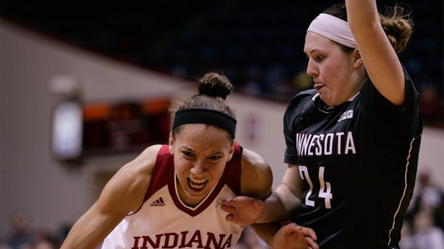 Junior guard Alexis Gassion dribbles the ball up the court against a Minnesota defender Feb. 18 at Assembly Hall.