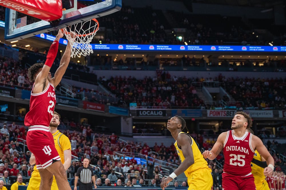 <p>Sophomore forward Trayce Jackson-Davis misses a dunk March 10, 2022, at Gainbridge Fieldhouse in Indianapolis. IU will play Illinois at 11:30 a.m. Friday. </p>