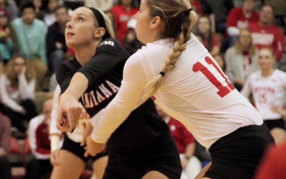 Taylor Lebo (left) and Allison Hammond receive the ball as IU competes against Nebraska on Saturday night.