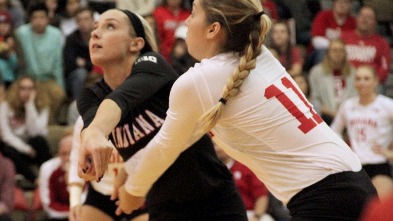 Taylor Lebo (left) and Allison Hammond receive the ball as IU competes against Nebraska on Saturday night.