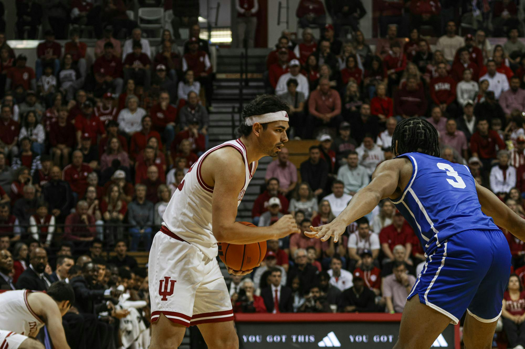 Fifth-year Senior Trey Galloway decides where to pass the ball in their game against EIU Nov. 10, 2024, at Assembly Hall in Bloomington. The Hoosiers took victory over the Panthers winning 90-55. 