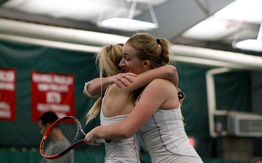 Doubles partners Madison Appel and Kim Schmider celebrate Sunday&nbsp;after defeating the No. 1 doubles team in the country, 6-4. The duo is now ranked 19th among all doubles pairs in the NCAA.