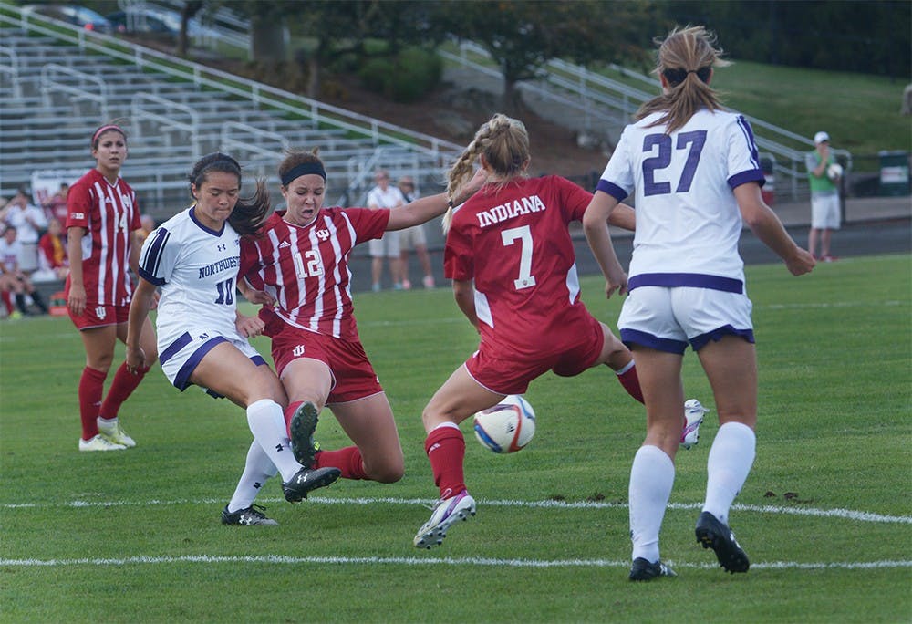 Freshman forward Hannah Johnson breaks through the Northwestern defense during the game on Sunday afternoon at Bill Armstrong Stadium. IU tied the game with Northwestern University 1-1.