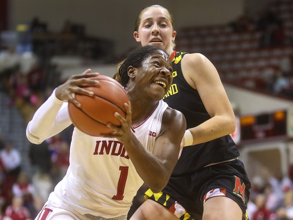 Sophomore guard Bendu Yeaney takes a hit on a drive to the basket in the first half of the women’s basketball game against Maryland on Sunday. Yeaney finished with 10 points for the Hoosiers.&nbsp;