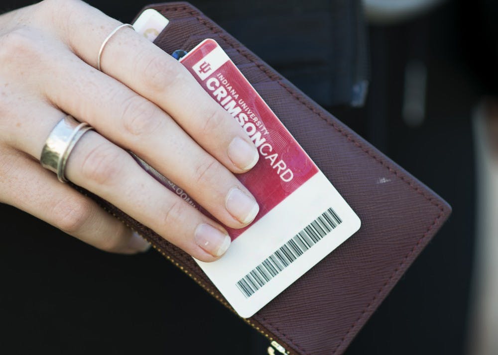 <p>A Crimson Card is held with a wallet. The Crimson Card system will undergo a maintenance upgrade from Jan. 4 to 7, according to an University Information Technology Services <a href="https://itnews.iu.edu/articles/2021/uits-news-for-12-15-2021.php" target="">press release. </a></p>