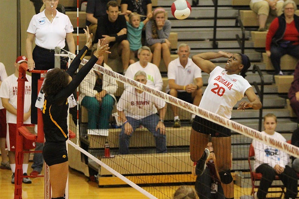 Senior middle blocker Awele Nwaeze spikes the ball during the match against Iowa on Wednesday evening at University Gym. The Hoosiers lost to the Hawkeyes 3 games to 0.