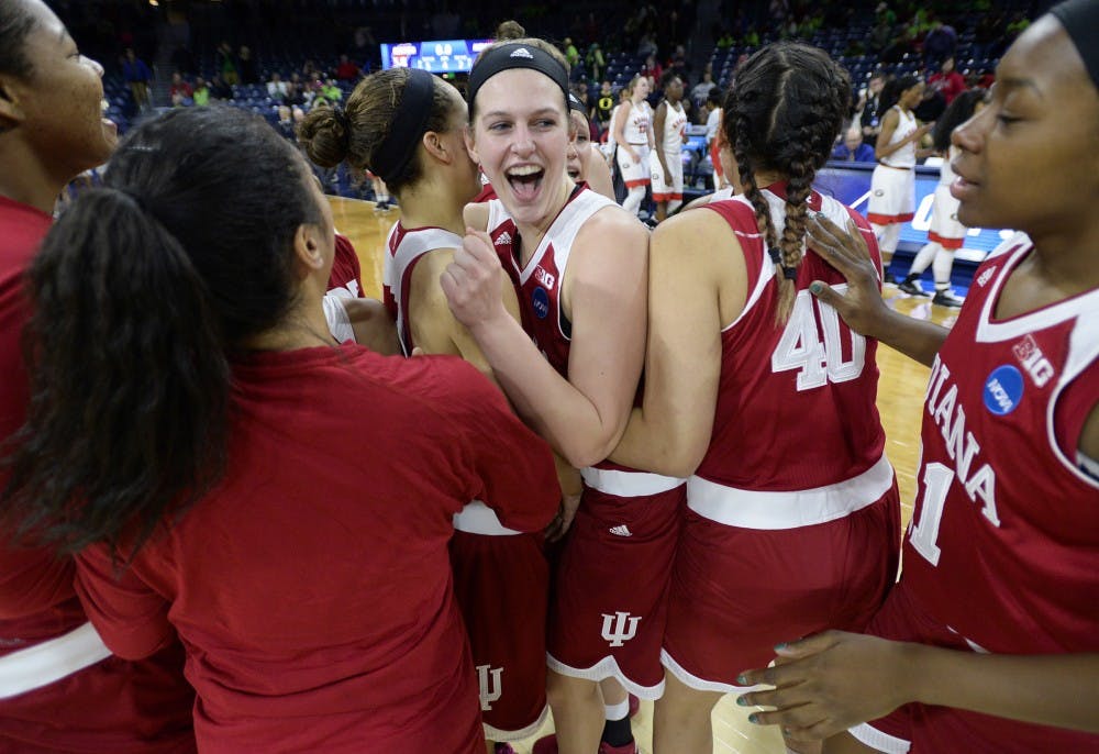 Junior guard Alexis Gassion hugs sophomore forward Amanda Cahill after beating Georgia 62-58 Saturday at Notre Dame. This was IU’s first NCAA tournament appearance since 2002. They will play Notre Dame on Monday.
