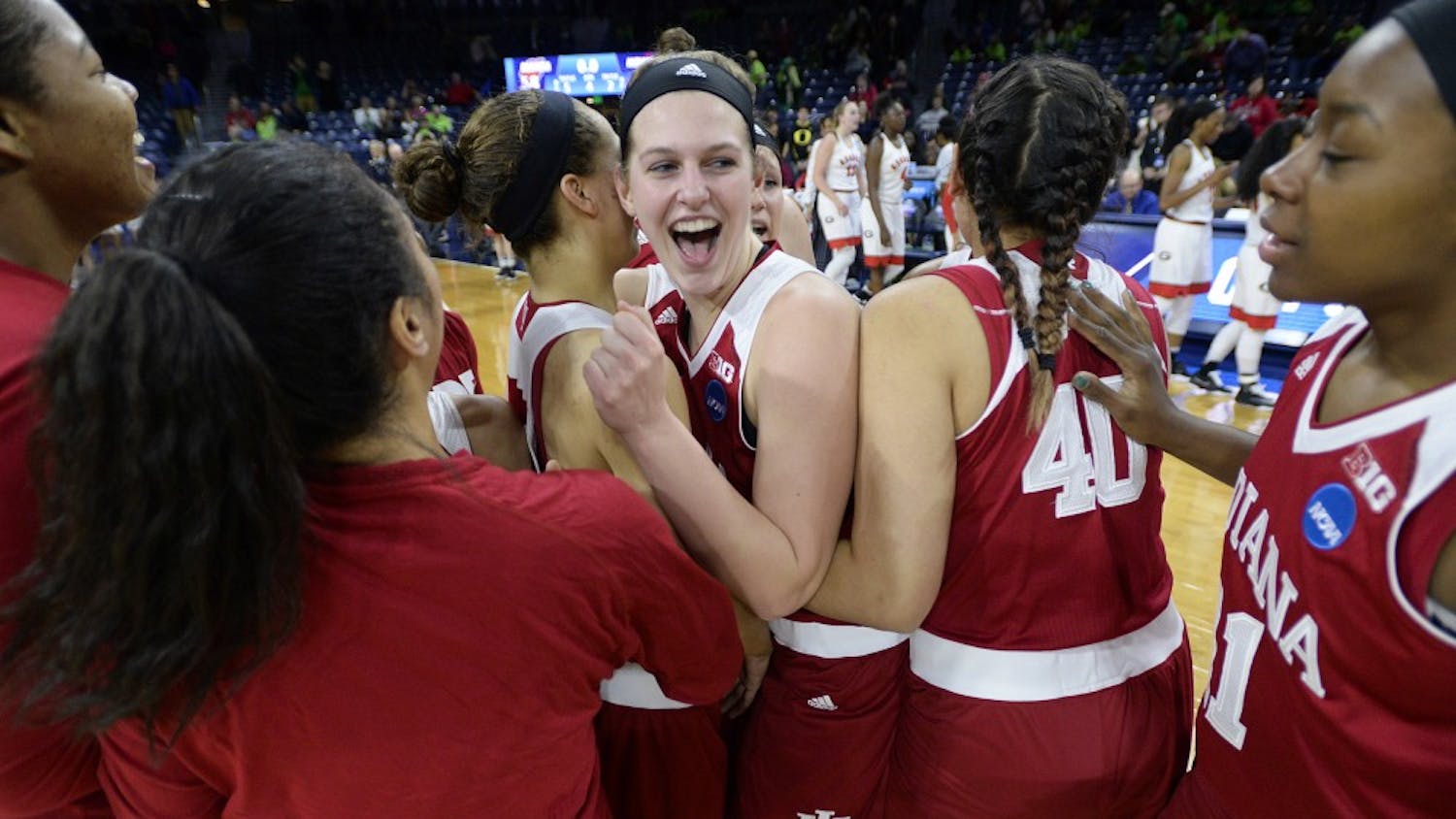 Junior guard Alexis Gassion hugs sophomore forward Amanda Cahill after beating Georgia 62-58 Saturday at Notre Dame. This was IU’s first NCAA tournament appearance since 2002. They will play Notre Dame on Monday.