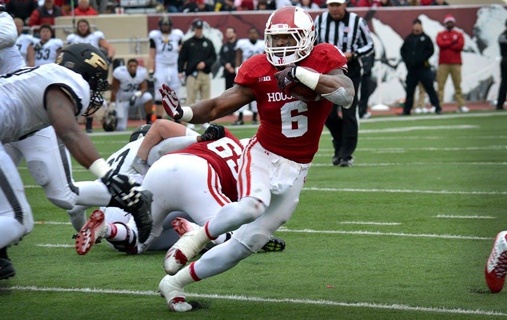 Junior running back Tevin Coleman runs the ball during IU's game against Purdue on Saturday at Memorial Stadium. Coleman surpassed 2,000 yards rushing on the season during the Hoosiers' final game of the year.