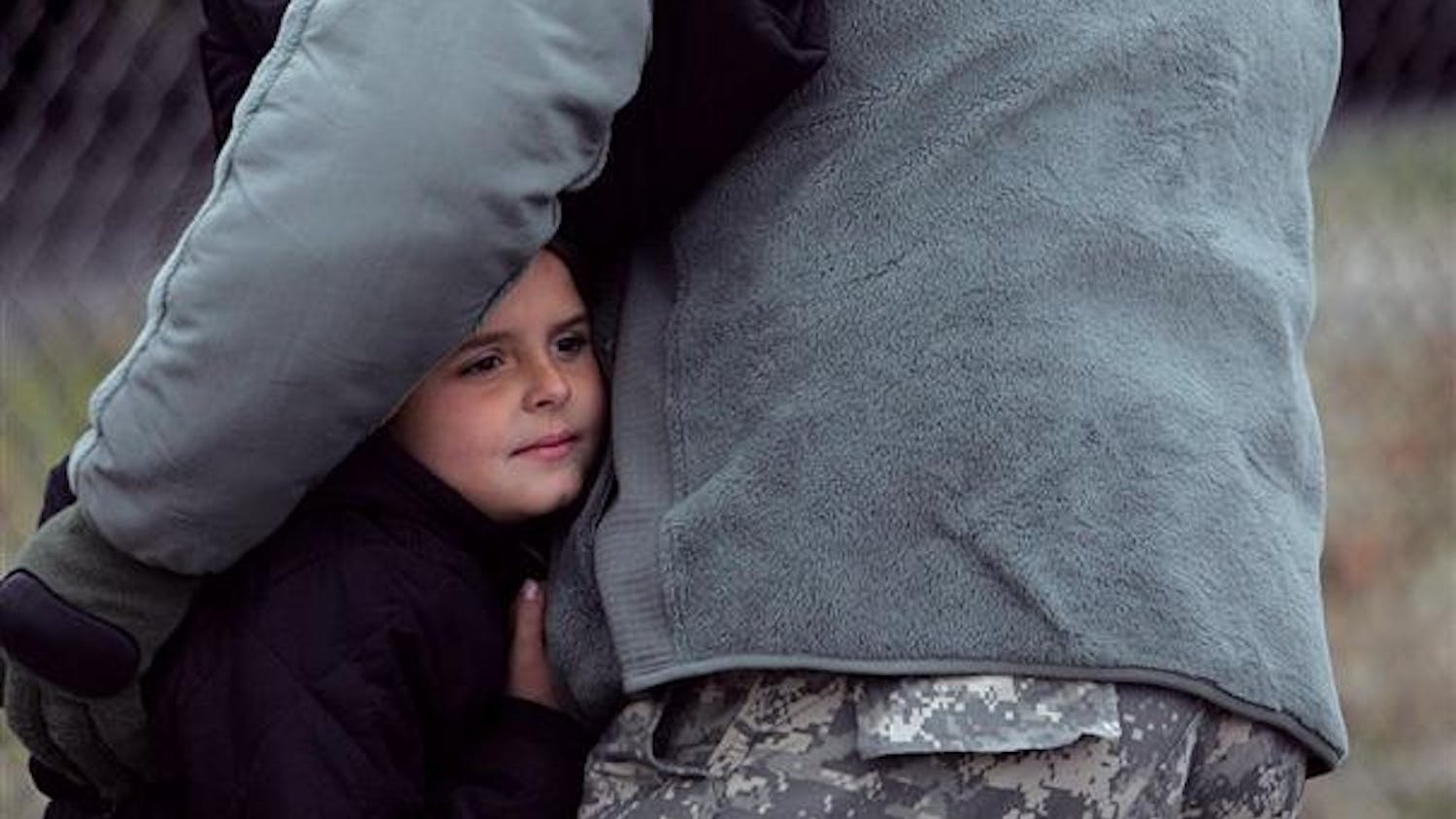 Spc. Marcus Hurtt, 29, of Mishawaka, Ind., says goodbye to his wife Sara, 31, and daughter Chloe, 5, as 120 soldiers from the U.S. Army Reserve's 855th Quartermaster Company in South Bend, Ind., depart on Monday for Fort McCoy in Wisconsin for further training and later deployment to Iraq.