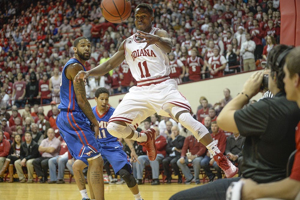Junior guard Kevin "Yogi" Ferrell passes the ball underneath the basket during IU's game against Southern Methodist on Nov. 20 at Assembly Hall.