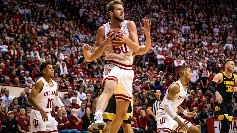 Then-junior Joey Brunk rebounds the ball during a game against Iowa on Feb.13, 2020. Brunk announced Tuesday that he will transfer and play his final year elsewhere.