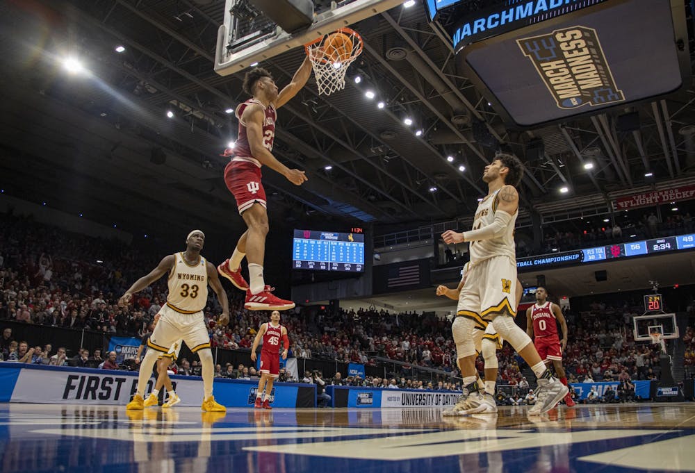 <p>Junior forward Trayce Jackson-Davis dunks the basketball against Wyoming on March 16, 2022, at the University of Dayton Arena in Dayton, OH. Jackson-Davis led the team with 29 points in the win over Wyoming in the First Four round of the NCAA tournament.</p>