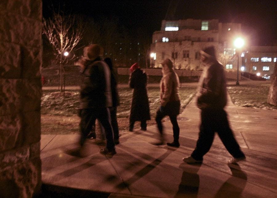 Members of the the campus safety commission walk through campus