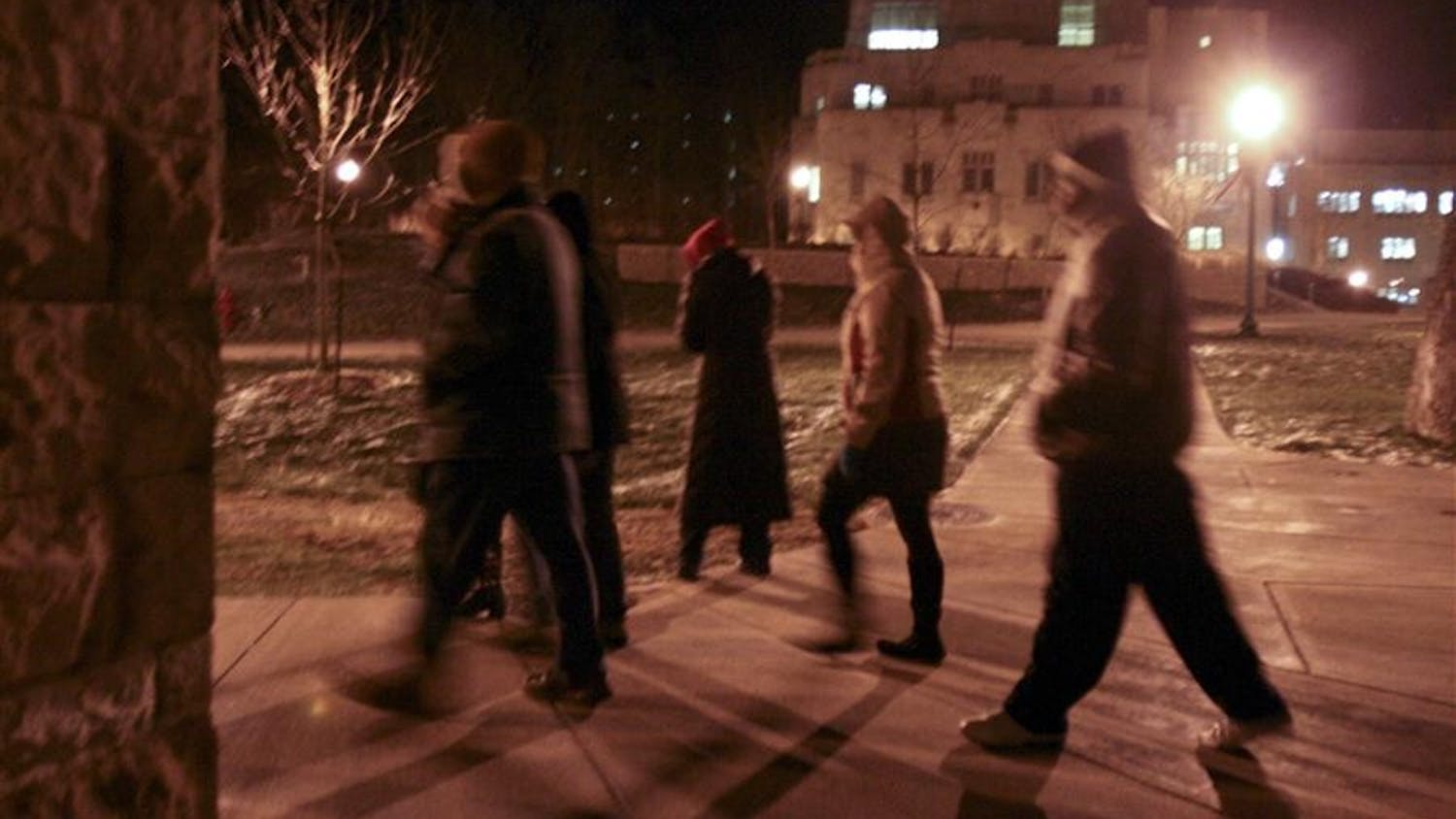 Members of the the campus safety commission walk through campus