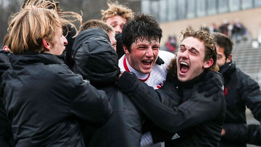 Then-sophomore redshirt defender Daniel Munie celebrates with his teammates after scoring the game-winning goal against Rutgers University on March 19, 2021, at Bill Armstrong Stadium. IU was one of four teams with players in the top 50 of Top Drawer Soccer&#x27;s Top 100 Players to Watch list.