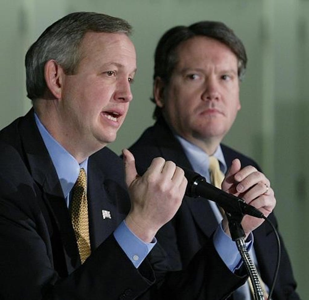 Fred Glass, right, the Marion County Capital Improvements Board president, looks on as Indianapolis Mayor Bart Peterson speaks during a press conference on Dec. 20, 2004 in Indianapolis. Glass is now a partner at Baker and Daniels in Indianapolis.