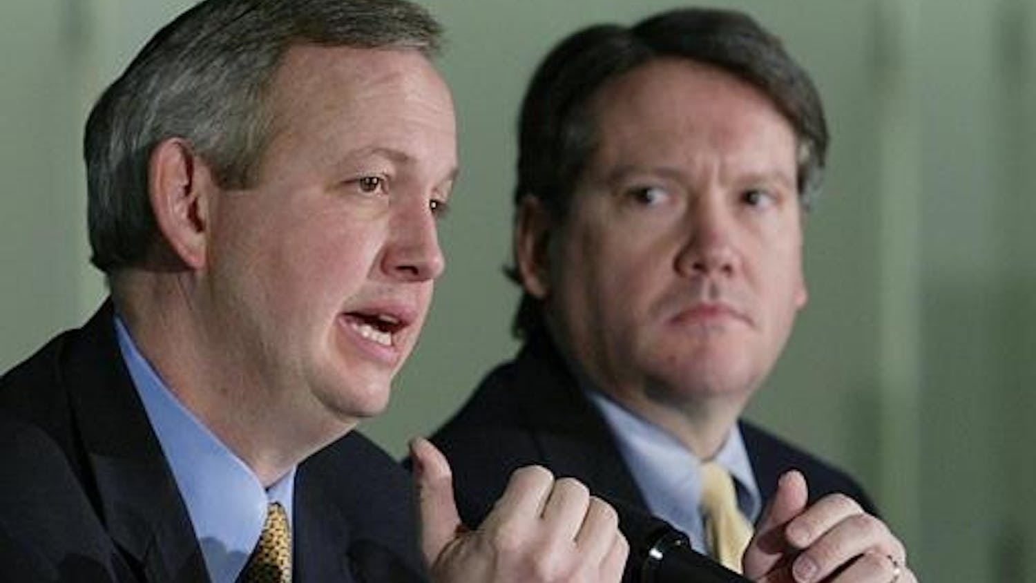 Fred Glass, right, the Marion County Capital Improvements Board president, looks on as Indianapolis Mayor Bart Peterson speaks during a press conference on Dec. 20, 2004 in Indianapolis. Glass is now a partner at Baker and Daniels in Indianapolis.