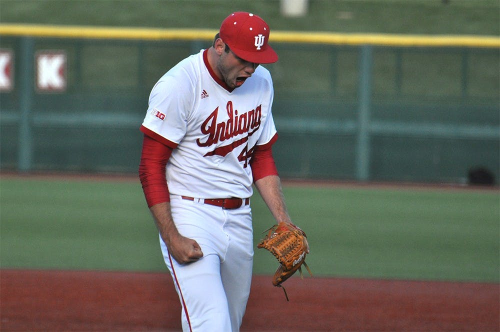 Junior pitcher Jake Kelzer celebrates his strike out which ended the 9th and the game. Purdue scored 4 earlier in the inning to leave IU with only a 1 run lead.