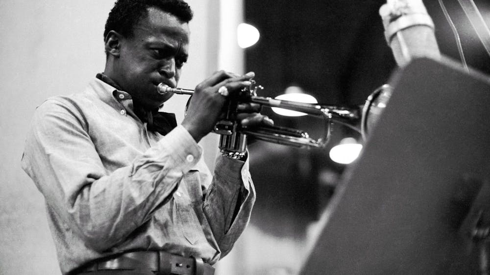 Jazz musician Miles Davis plays the trumpet in 1959. Many Black musicians have faced consequences of copyright laws and claims that pieces of music have been stolen without credit. 