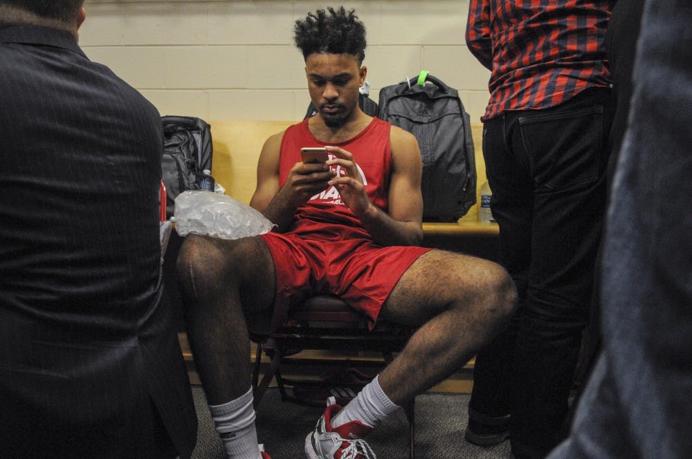Sophomore guard James Blackmon Jr. ices his leg during locker room interviews on Thursday at the Wells Fargo Center. Blackmon, who injured his knee in December, practiced today but will not play in tomorrow's Sweet Sixteen game against number one seed North Carolina. 