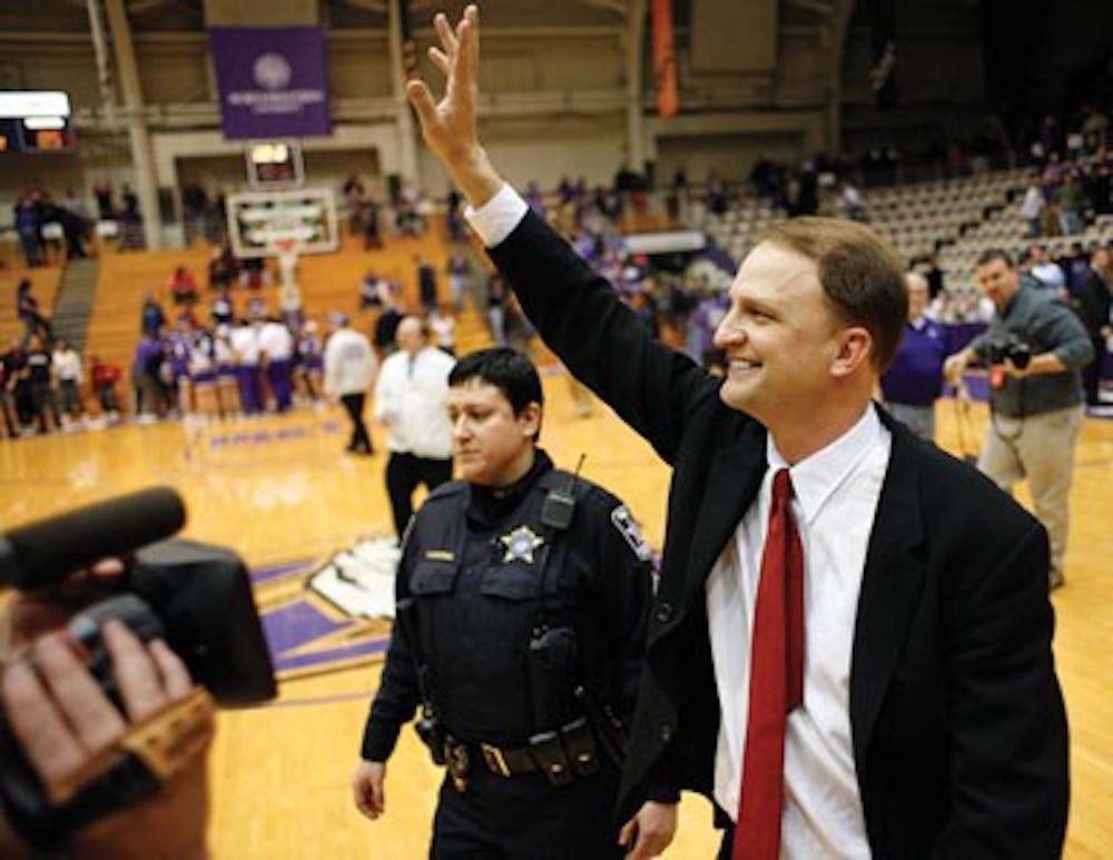 Dan Dakich waves following his first game as the IU's interim head basketball coach versus Northwestern.  