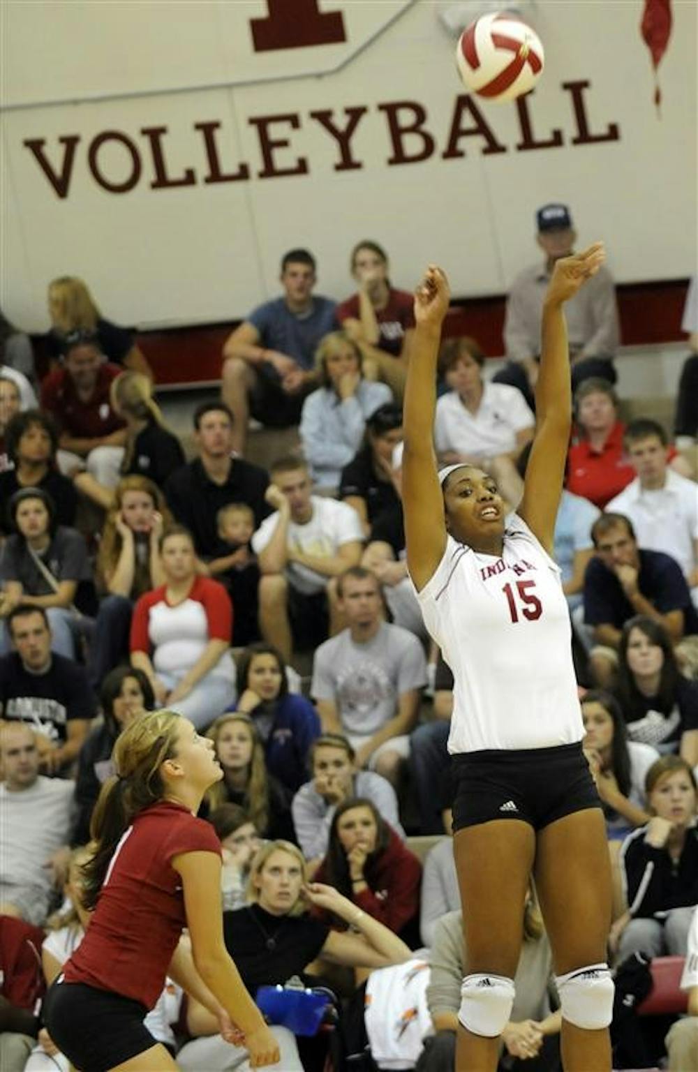 IU senior Erica Short, No. 15, sets the ball during the TIS Bookstore Invitational on Friday, Sept. 19, at University Gym. IU swept Ball State 3-0.