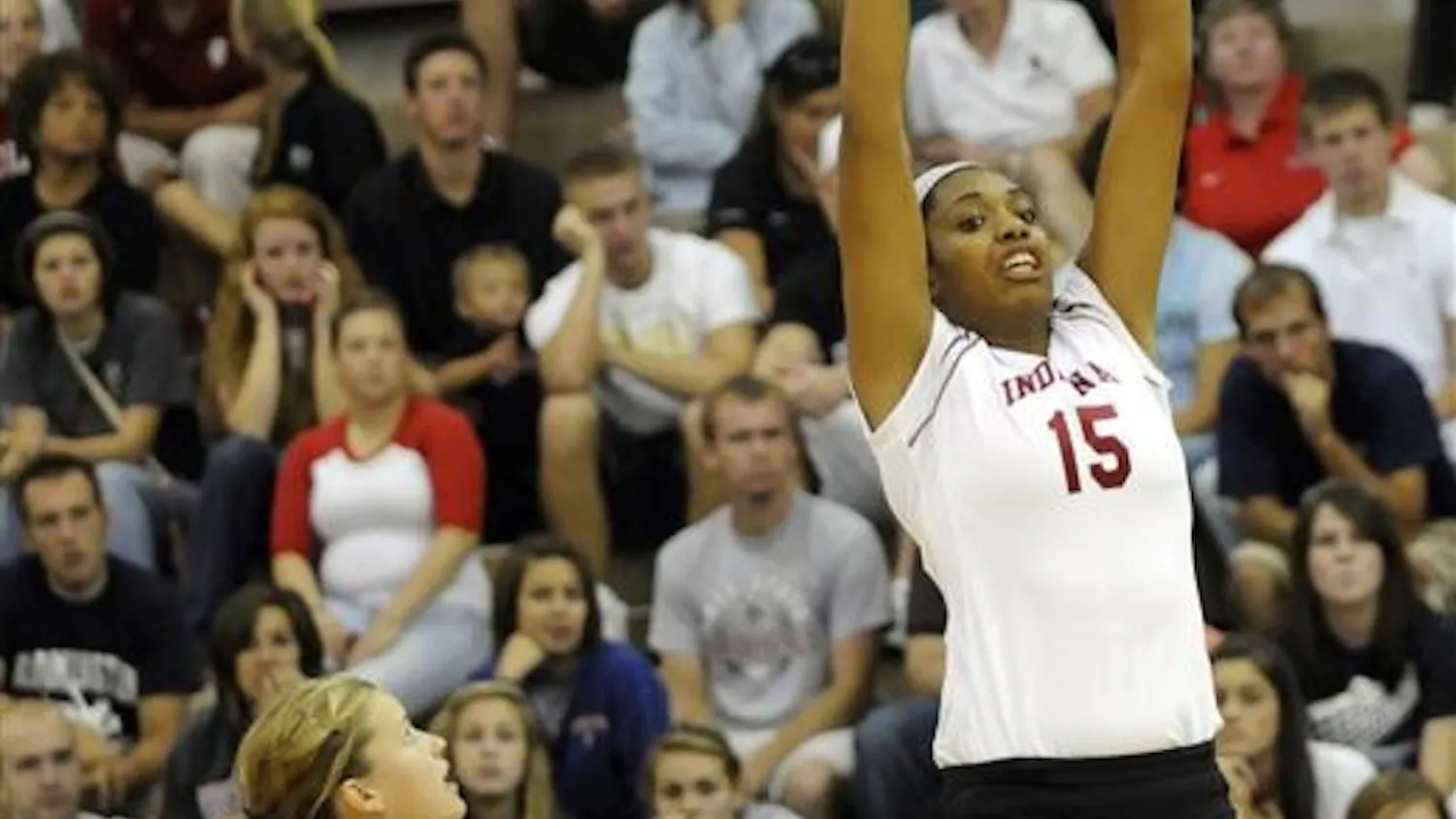 IU senior Erica Short, No. 15, sets the ball during the TIS Bookstore Invitational on Friday, Sept. 19, at University Gym. IU swept Ball State 3-0.