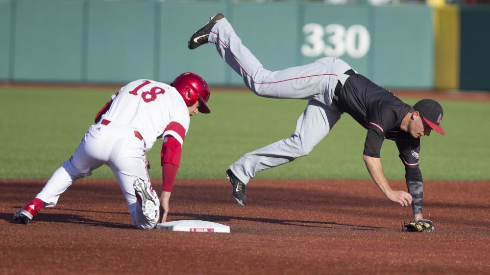 Then-junior first baseman Austin Cangelosi is tagged by the Ball State second baseman as he slides into second April 25, 2017, at Bart Kaufman field. The Hoosiers have won five-straight games in 2018 after defeating Boston College 4-0.&nbsp;