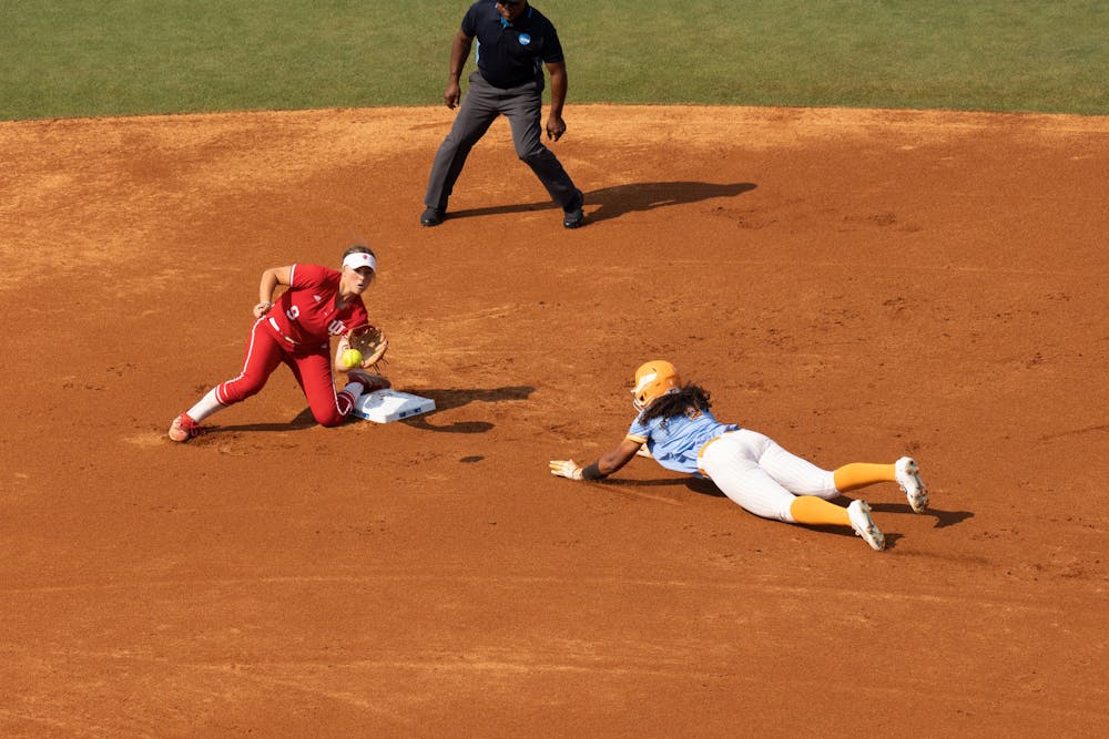 Indiana softball's freshman Teryn Kern attempts to catch the ball and swipe the tag against the University of Tennessee at Sherri Parker Lee Stadium Sunday, May 21. Kern entered the transfer portal Monday. 