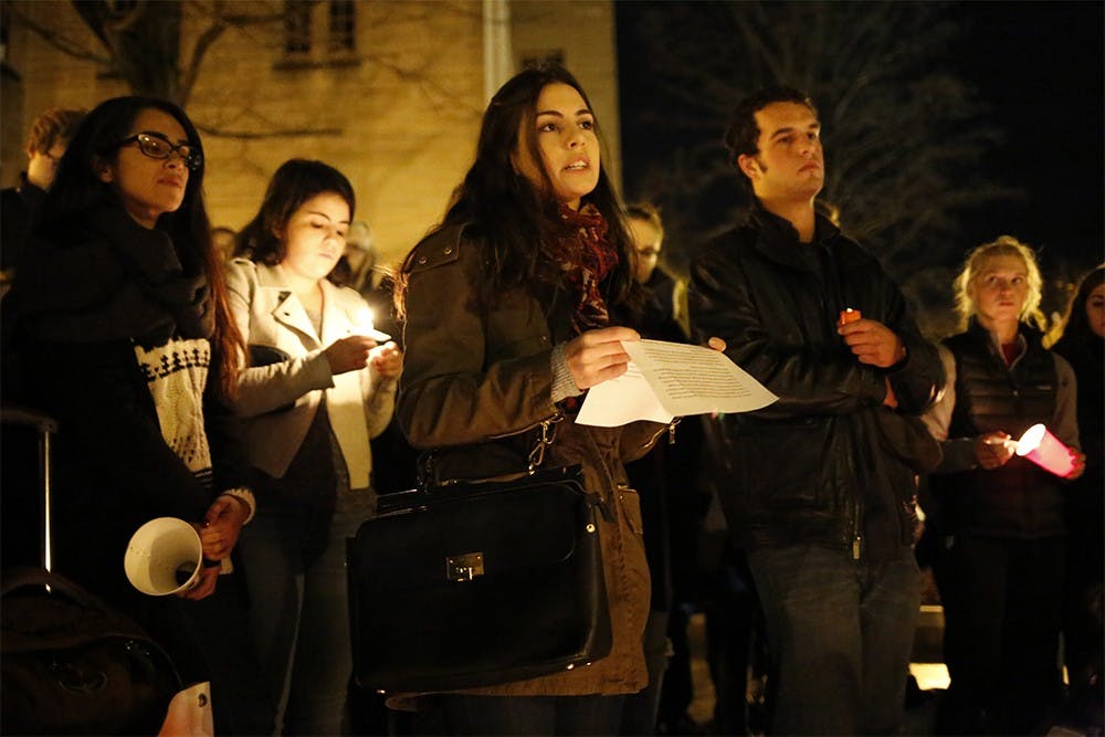 Dana Khabbaz speaks in front of a group gathered for a candlelit vigil that was scheduled in light of the recent terrorist attacks in Paris as well as Beirut. "Keep those in Syria and Iraq in thoughts as well, as it is not over for them," she said. "We stand with the people of Beirut, we stand with the people of Paris, we stand with the people of Baghdad, we stand with the people of all of these locations that have suffered at the hands of terror," she said.