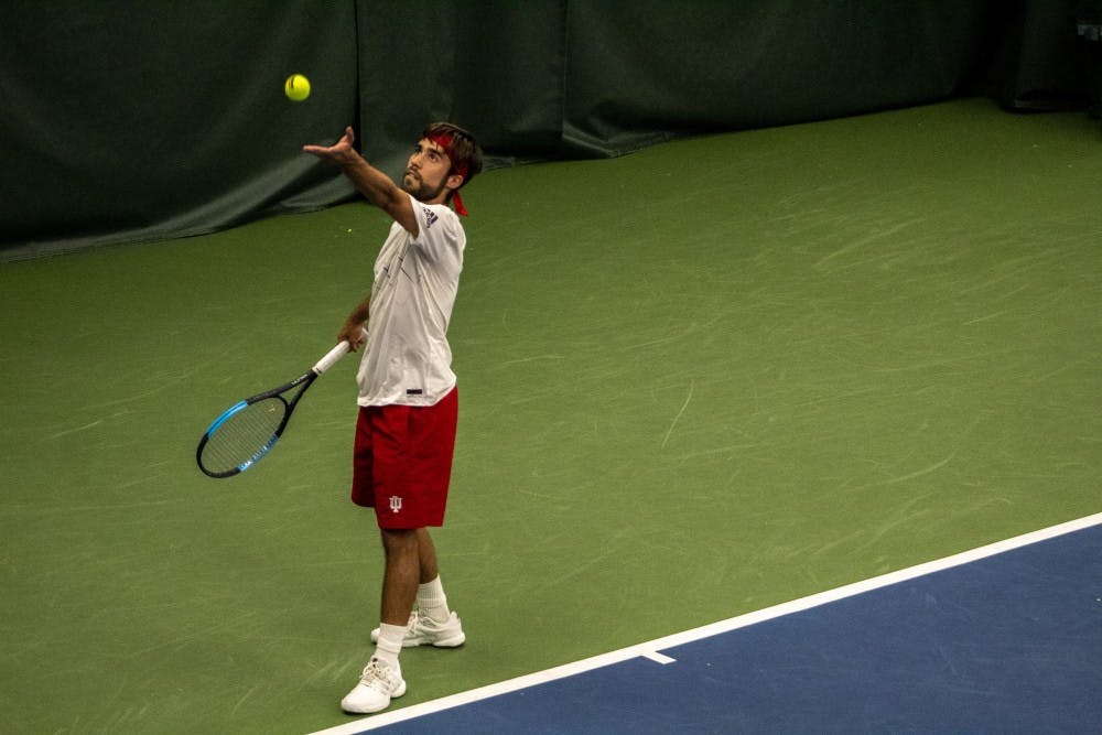 <p>Senior Antonio Cembellin serves during his final match in Bloomington on April 14 at the IU Tennis Center. IU will play Penn State on Friday in University Park, Pennsylvania. </p>