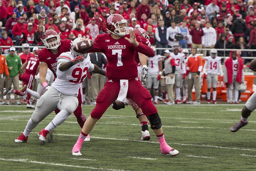 Senior quarterback Nate Sudfeld looks to pass the ball during the first half of IU's game against Ohio State on Saturday at Memorial Stadium. After losing both Sudfeld and running back Jordan Howard in the second half, IU lost 27-34. 