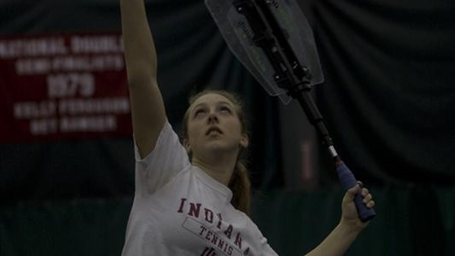 Sophomore Charlotte Martin warms up her serve during practice on Tuesday afternoon at the Varsity Center. Martin and the IU Womens Tennis team have only had four losses this season.