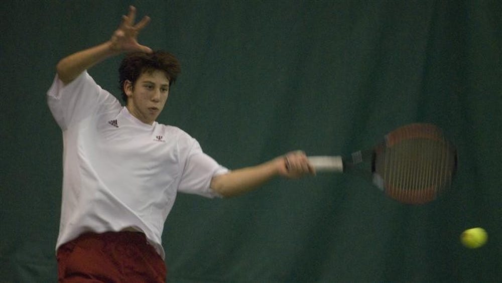 IU freshman Jeremy Langer hits a forehand during his singles match against Northwestern Sunday afternoon at the IU Tennis Center. Langer lost his match in a tie breaker.