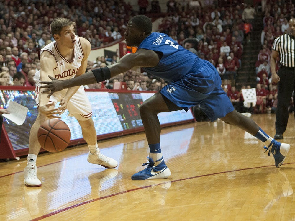 Junior forward Collin Hartman passes the ball during the game against Creighton on Thursday at Assembly Hall.