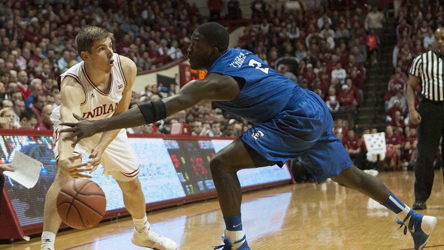 Junior forward Collin Hartman passes the ball during the game against Creighton on Thursday at Assembly Hall.