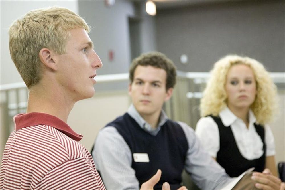 Senior golfer Drew Allenspach, IUSA president Luke Fields, and IUSA Co-director of Public Relations Stefanie Smith participate in an IUSA-sponsored forum at which audience members were able to discuss issues concerning the hiring of a new IU Athletics Director Tuesday night in the Frangipani Room at the IMU.