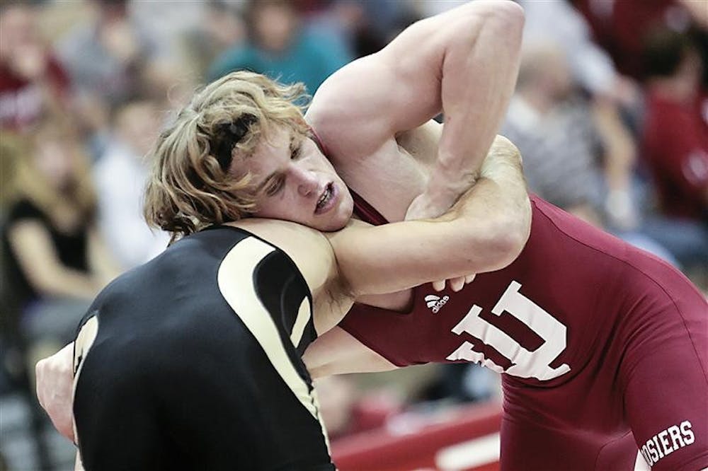 Redshirt sophomore Kurt Kinser battles Purdue's Colton Salazar during the Hoosiers 21-12 win over the Boilermakers Feb. 6 at University Gym. Kinser defeated Salazar 12-6.
