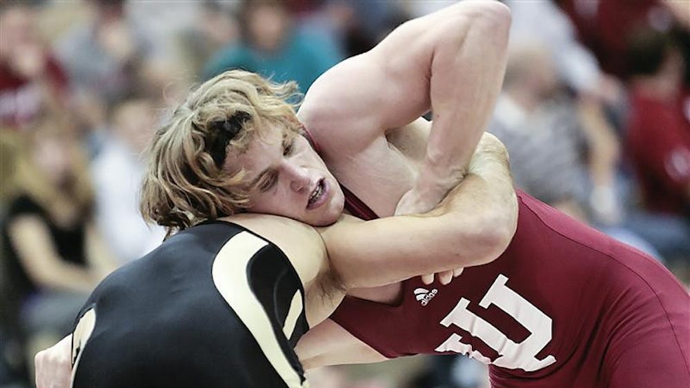 Redshirt sophomore Kurt Kinser battles Purdue's Colton Salazar during the Hoosiers 21-12 win over the Boilermakers Feb. 6 at University Gym. Kinser defeated Salazar 12-6.