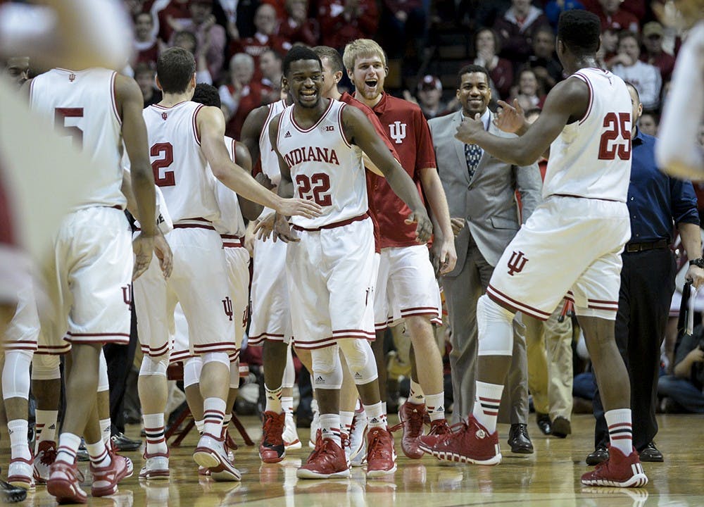 Sophomore Stan Robinson greets his teammates with a smile during a timeout in the second half of IU's game against Ohio State on Saturday at Assembly Hall. IU defeated the No. 22 Buckeyes, 69-66.