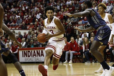 Sophomore forward Justin Smith runs the ball up the court against Montana State on Nov. 9 in Simon Skjodt Assembly Hall. Smith scored 13 out of the 80 points. IU won against Montana State, 80-35.