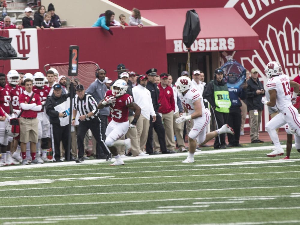 Junior running back Alex Rodriguez runs the ball down the field for IU against Wisconsin on Nov. 4. Rodriguez will transfer from IU before next season.&nbsp;