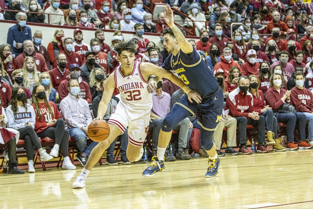 <p>Sophomore guard Trey Galloway dribbles against his Michigan defender on Jan. 23, 2022,at Simon Skjodt Assembly Hall. Indiana will face Michigan at 11:30 a.m. Thursday at the Big Ten Tournament. </p>
